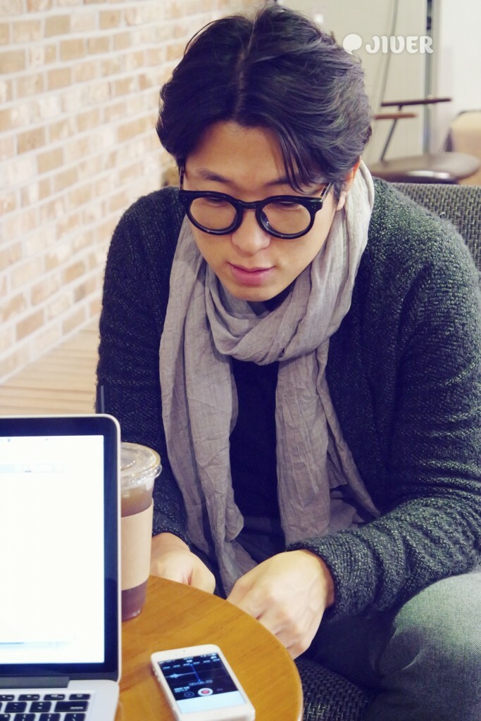 Blog person in glasses looking down