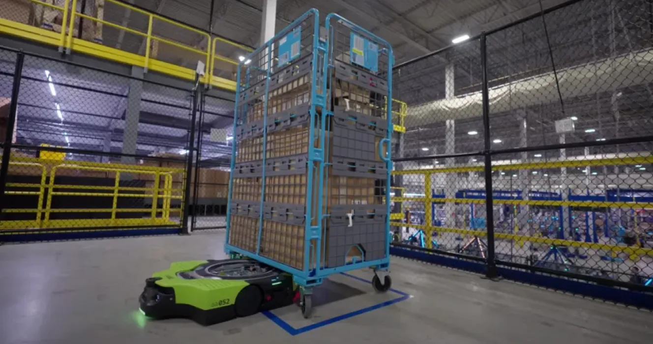 Equipped with sensors and an internal map of its environment, Amazon’s Proteus moves inventory carts throughout the warehouse.
